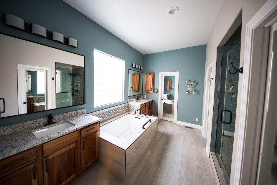 Professional bathroom remodeling contractor assessing a project